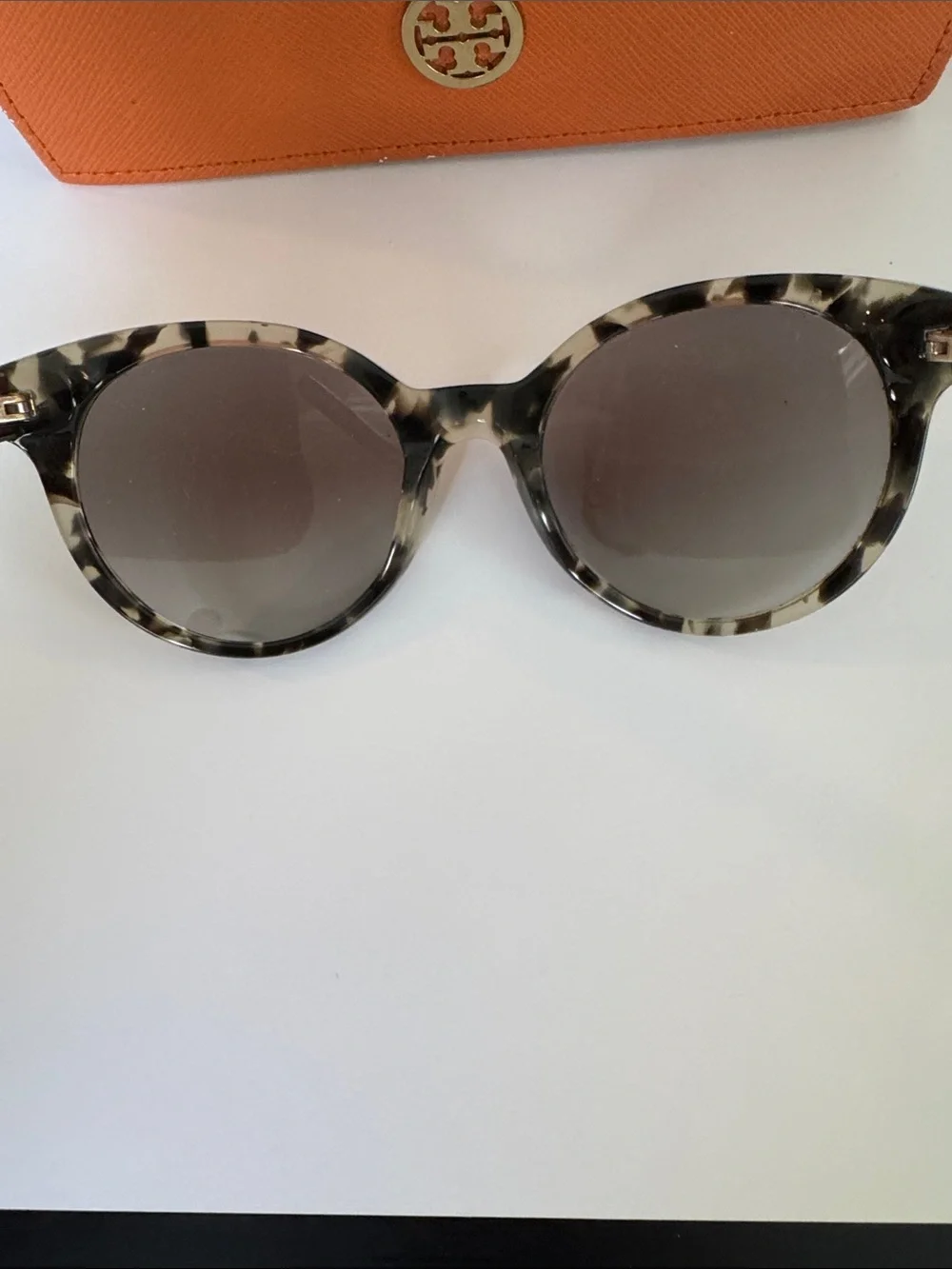 Tory Burch sunglasses.